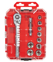 A clear plastic red tool case containing a metal ratchet wrench labeled 'Craftsman', a socket extension, and six metal sockets of varying sizes neatly organized inside.