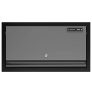 A rectangular gray metal cabinet with a black frame, a lock in the center, and a CRAFTSMAN logo in the top right corner.
