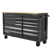 Large black rolling tool chest with multiple drawers, featuring an American flag design on the front and a light wood top. The chest is labeled with the brand name 'Craftsman' and has casters for mobility.