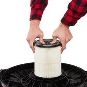 Photo of Craftsman CMXZVBE38754 pleated vacuum filter being installed, close-up on white background.