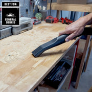 Craftsman vacuum nozzle CMXZVBE38776 cleaning general debris from a wooden workbench in a workshop.