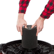 Photo of hands installing a Craftsman wet/dry vacuum filter, SKU CMXZVBE38778, black foam cylinder, top view, white background.